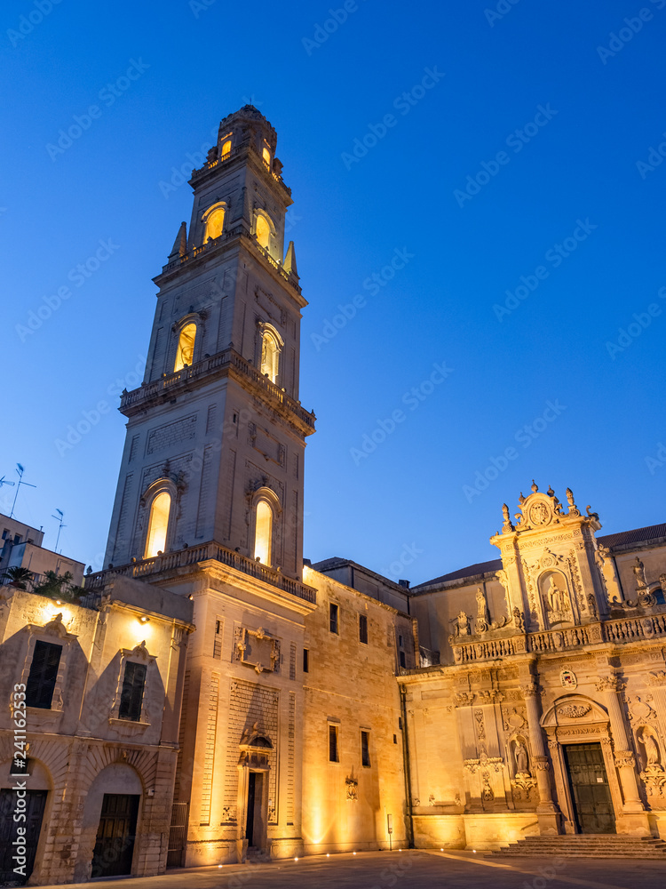 Beautiful vertical image with tall tower bell of Catholic cathedral in Piazza Del Duomo square of Lecce city, Italy