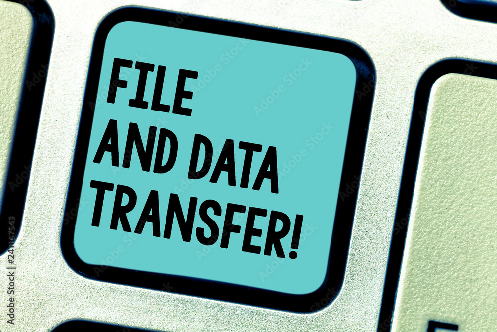 Fototapeta premium Handwriting text writing File And Data Transfer. Concept meaning Transferring information online by the internet Keyboard key Intention to create computer message pressing keypad idea