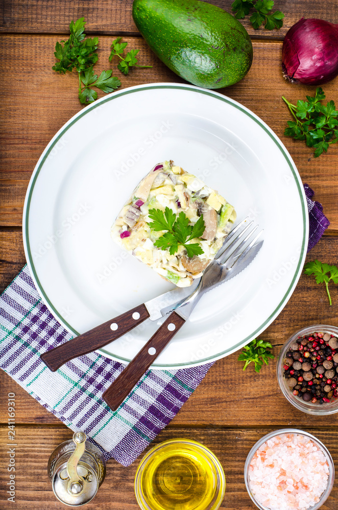 Dishes with avocado, salad with mushrooms and eggs, mayonnaise sauce Dishes with avocado, salad with mushrooms and eggs, mayonnaise sauce