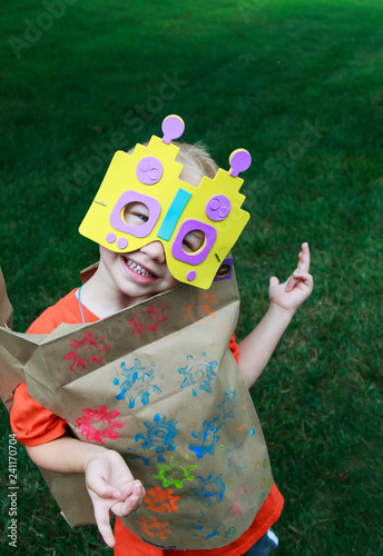 Young boy playing dress up as a robot
