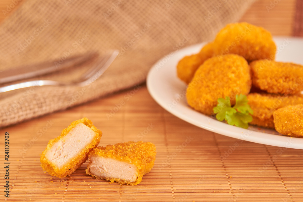 Naklejka premium Delicius fried chicken nuggets with sauce