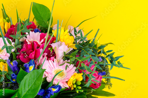 Mix of summer flowers in bouquet on bright background