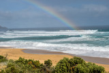 Rainbow in the waves at Gunnamatta Beach, Australia