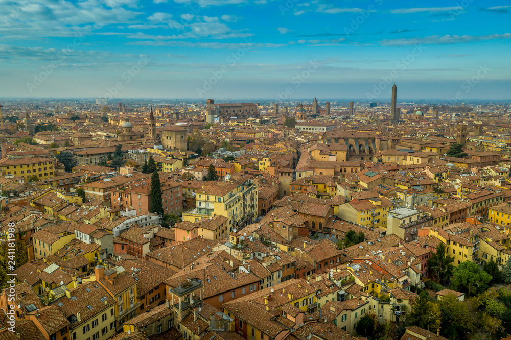 Aerial view of Bologna the capital city of Emilia Romagna province in Italy home to the best food and two leaning towers on a winter afternoon with sun set cloudy sky