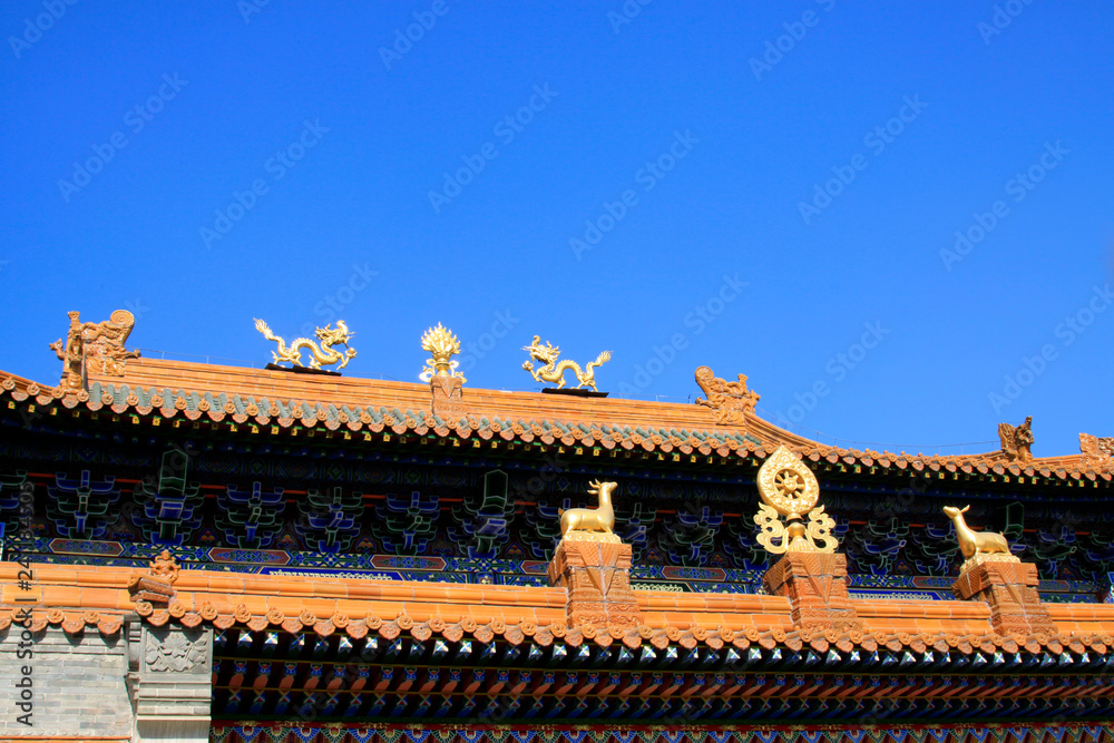 Glazed tile roof and Gilding copper Dharma chakra in a temple