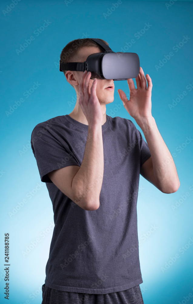 Young man using VR Virtual Reality headset Young man using VR Virtual Reality headset