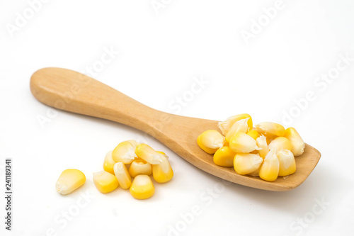 fresh sweet corn in wood spoon isolated