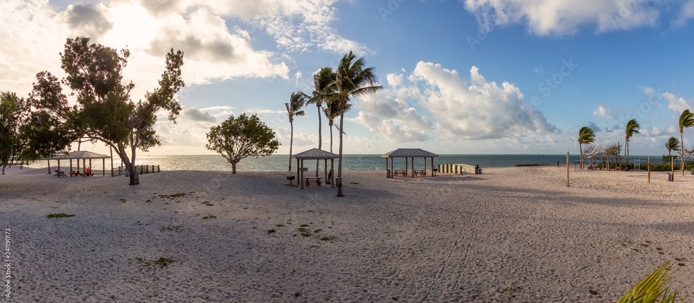 Panoramic View of a beautiful sandy beach on the Atlantic Ocean Coast during a vibrant sunny morning. Taken in Sombrero Beach, Marathon, Florida, United States. Panoramic View of a beautiful sandy beach on the Atlantic Ocean Coast during a vibrant sunny morning. Taken in Sombrero Beach, Marathon, Florida, United States.