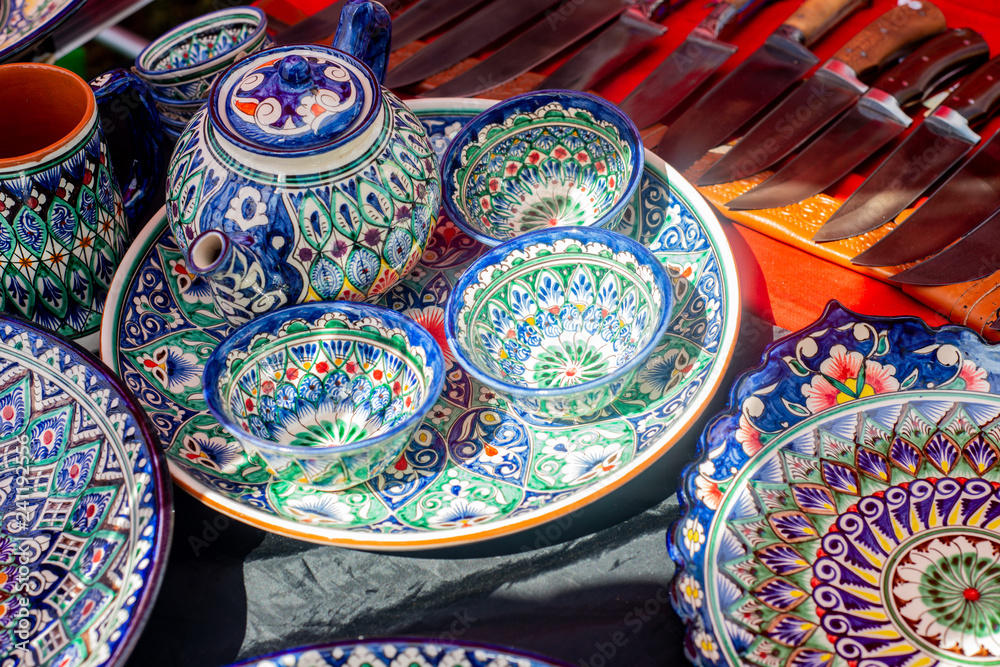 Pottery of colorful hand painted ceramic bowls and plates