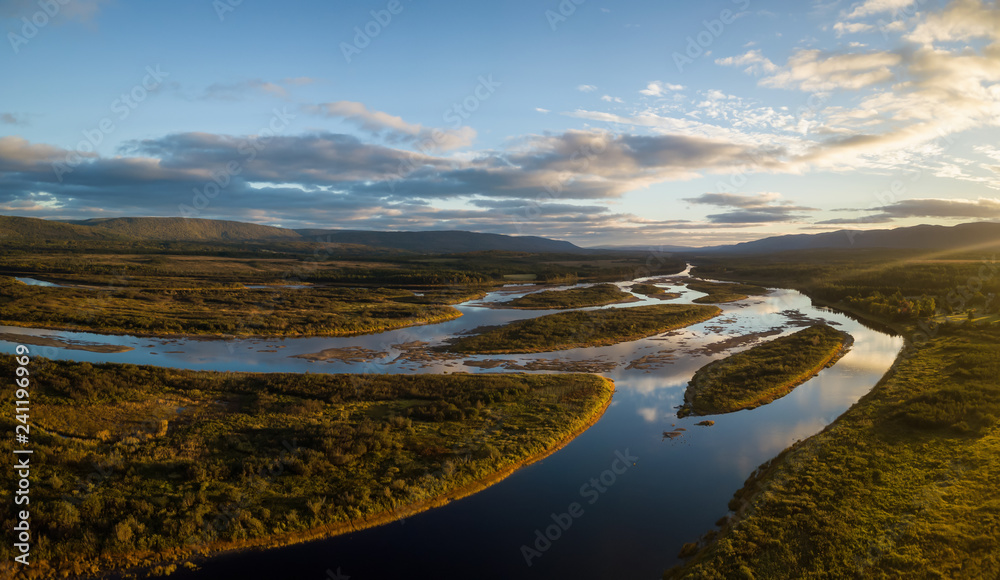 Aerial landscape view of a beautiful river during a sunny sunrise. Taken in Codroy Valley, Newfoundland, Canada. Aerial landscape view of a beautiful river during a sunny sunrise. Taken in Codroy Valley, Newfoundland, Canada.