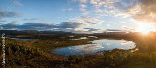Fototapeta Naklejka Na Ścianę i Meble -  Aerial landscape view of a beautiful river during a sunny sunrise. Taken in Codroy Valley, Newfoundland, Canada.