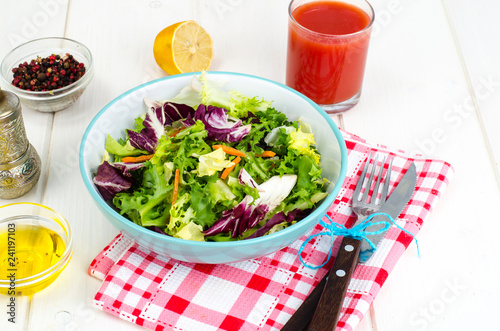 Salad from mix of herbs (iceberg, radiccio, friis, romance, carrot, arugula). Vegetarian, vegan concept photo