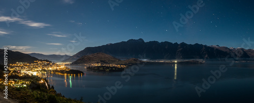 Panorama night view of Queenstown, Lake Wakatipu and The Remarkables mountain in New Zealand