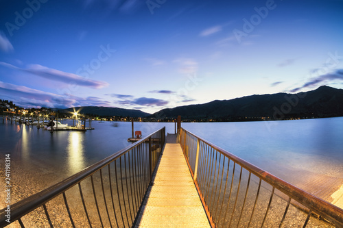 Taken in Wanaka, New Zealand, this harbor dock is a gateway to sail the beautiful lake.