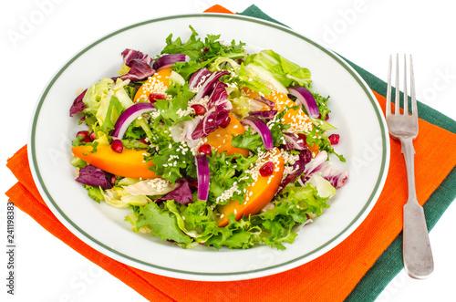 Salad with persimmon and sesame seeds, healthy food.