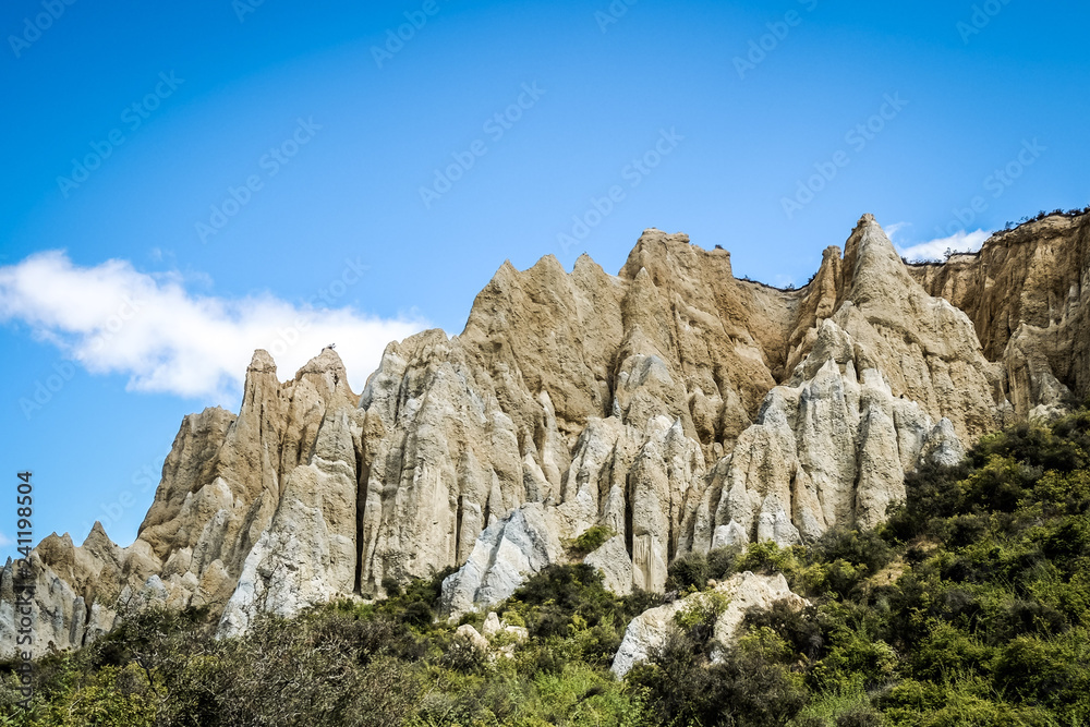 The Clay Cliffs are a famous attraction in New Zealand. Its tall pinnacles are separated by narrow ravines. These natural rock formations are formed a million years ago. It is breathtaking. The Clay Cliffs are a famous attraction in New Zealand. Its tall pinnacles are separated by narrow ravines. These natural rock formations are formed a million years ago. It is breathtaking.
