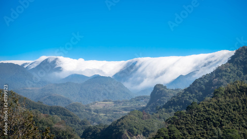 Very interesting clouds formation. There are a lot of moisture in the air. The clouds forms a sea over the mountain ranges. This phenomenon is breathtaking. This image can make a good background.