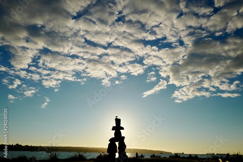 Silhouette of First Nations statue at sunset