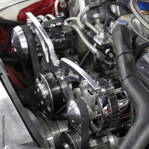 Obraz na płótnie Old scool V8 turbo compressor motor engine in red tuned American muscle car - supercharger, belt on pulleys w salonie