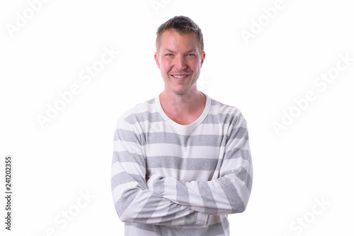 Young happy handsome man smiling isolated against white background © Ranta Images
