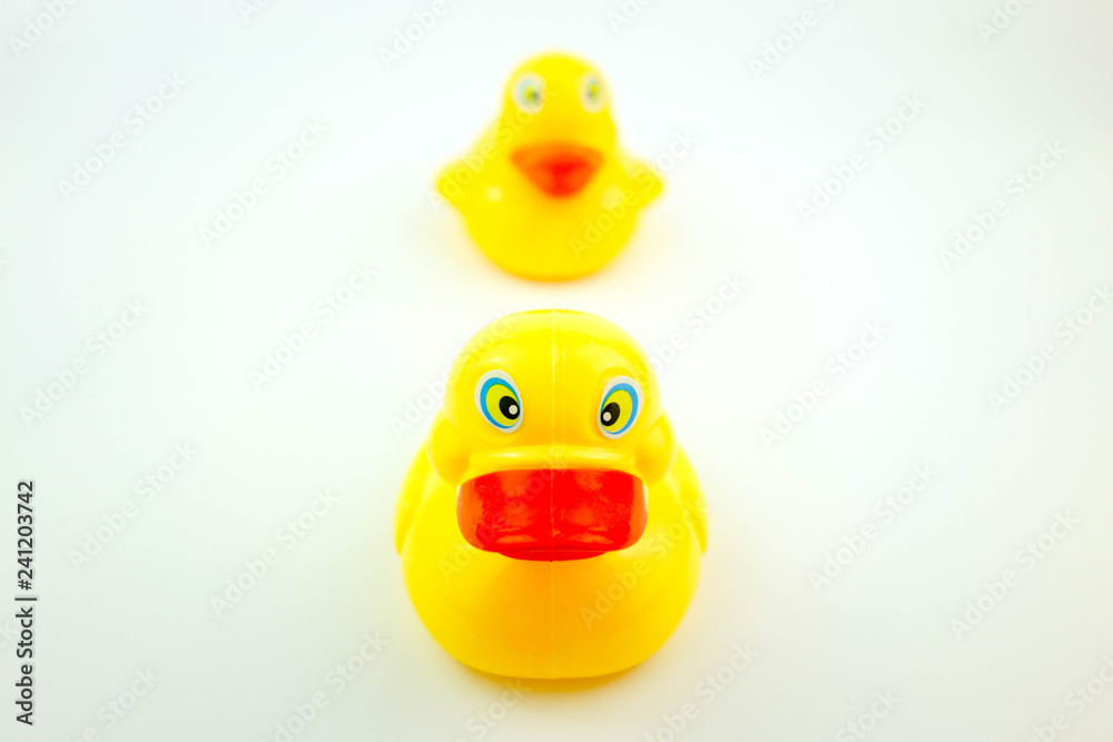 Yellow rubber duck on white background. Leadership concept. Yellow rubber duck on white background. Leadership concept.