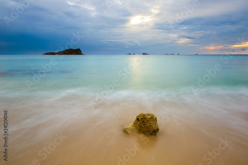 Cala Conta (Platges de Comte) at sunset, Ibiza, Spain photo