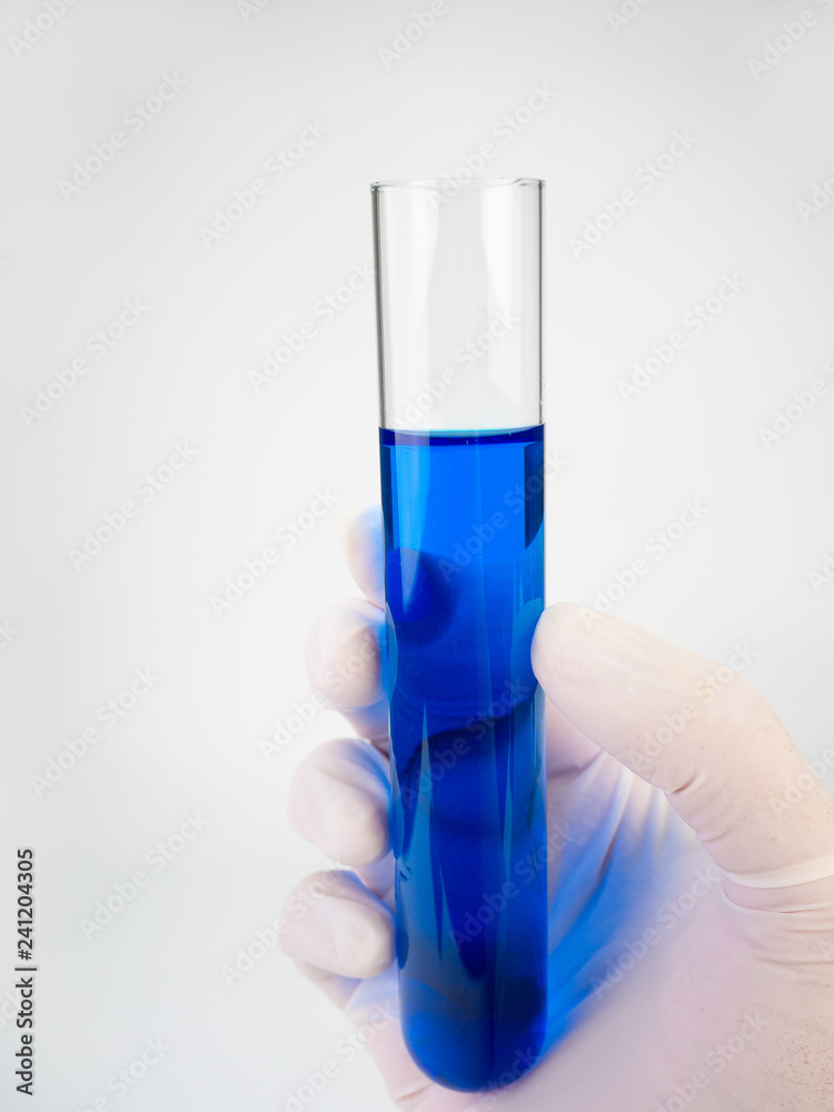chemist holding a test-tube. chemist holding a test-tube.