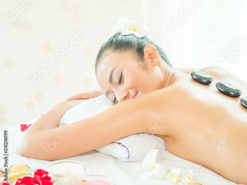 Young asian beautiful woman relaxing in spa salon