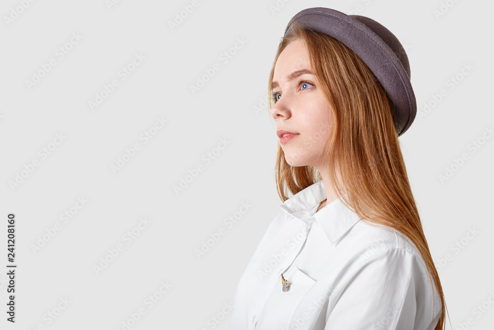 Profile shot of thoughtful woman wears hat and elegant shirt, focused into distance, isolated over white background with free space for your advertisement or promotional content. Pensive girl Profile shot of thoughtful woman wears hat and elegant shirt, focused into distance, isolated over white background with free space for your advertisement or promotional content. Pensive girl