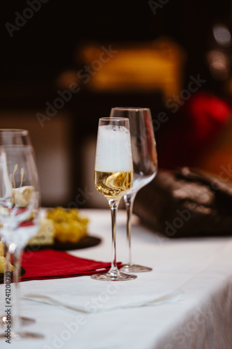 A glass of white champagne sparkling bubble wine