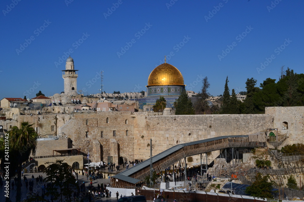 Daylight view on Dome of Rock and western wall in Jerusalem Israel, Kotel, golden dome, blue sky