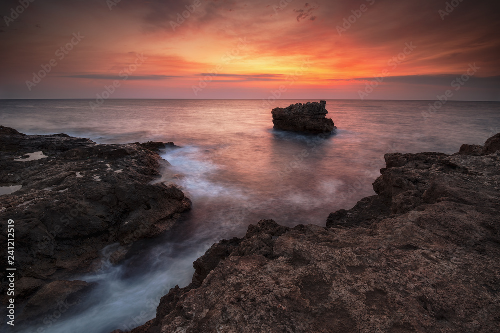Sea sunrise, near the rocks