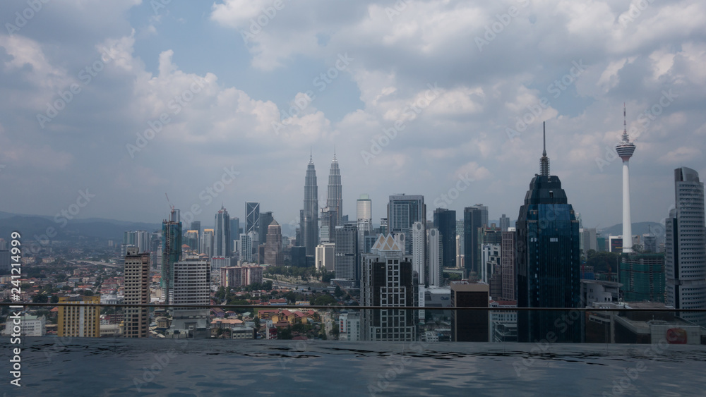 Cityscape view of Kuala Lumpur, Malaysia, hazy day with clouds