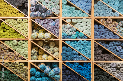 Fototapeta Naklejka Na Ścianę i Meble -  Colorful woolen yarns on shelves ready for knitting