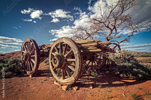 Fototapeta Australia – Outback savanna with an old vintage derelict horse-drawn carriage at