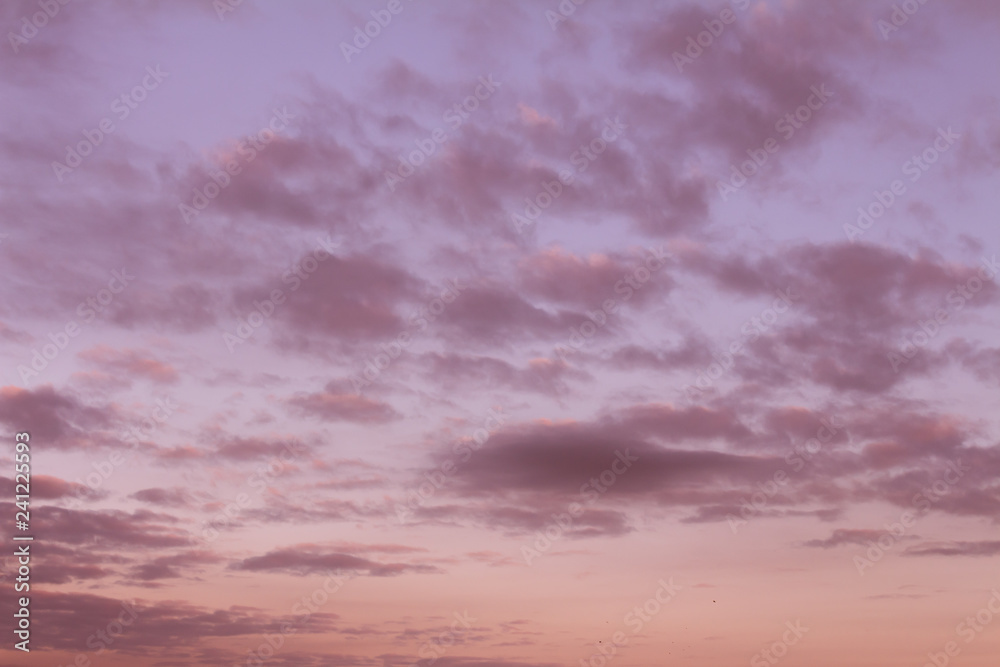 numerous small clouds during sunset. resource for designers.