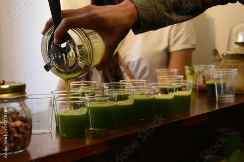 Healthy, colourful smoothies in a small cups.