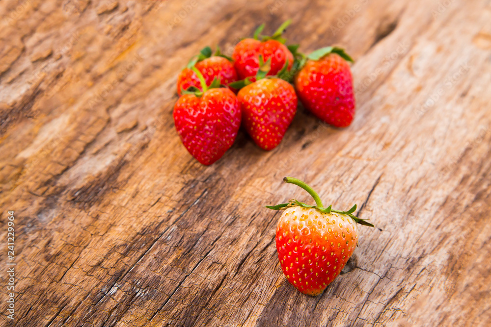 Frash Strawberry on wood background. Space for Text