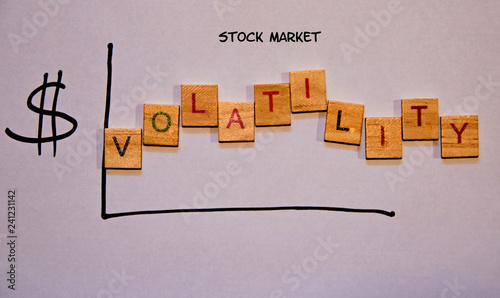 фотографія Drawn graph indicating volatility in the stock market.