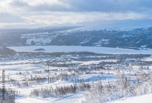 Panoramic view of winter landscape in Beitostolen with frozen lake Oyangen in the distance. Winter in Norway