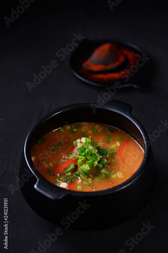 Hungarian goulash soup bograch, meat stew in a cast iron pot. meat restaurant, ethnic cuisine.