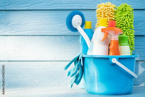 Tablou pe pânză House cleaning product on wood table with blue background