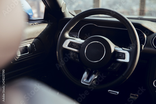 Steering wheel of luxury car © Aitor