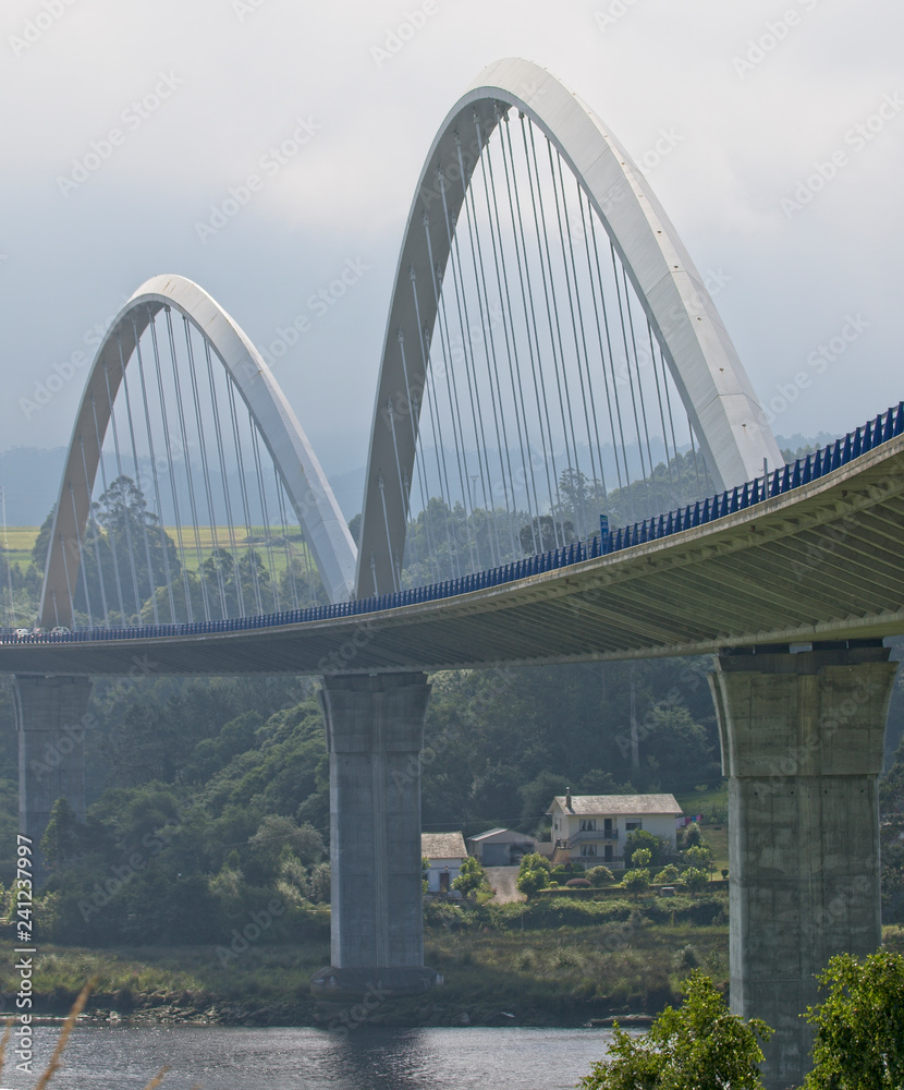 Fototapeta premium The bridge over the River Navia carrying the A-8, Asturias, Spain.
