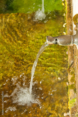 Spout of an old water fountain © clavivs