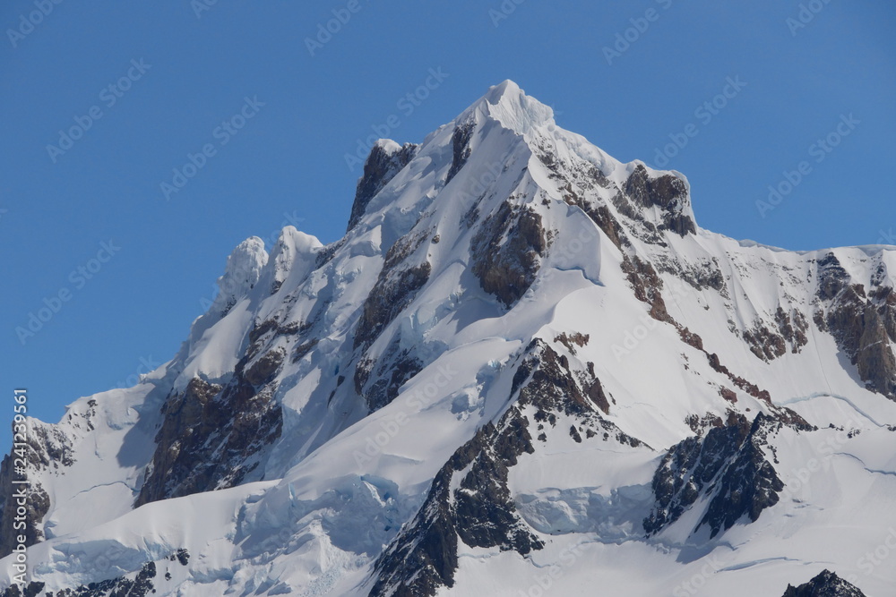 Peak of a mountainb with snow / glacier