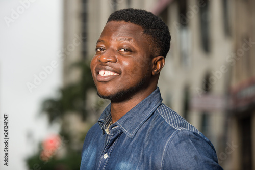 Konstfotografi close up of young african man smiling.