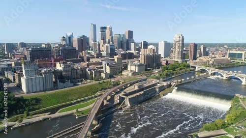 Downtown Minneapolis along the Mississippi River in the summer by drone