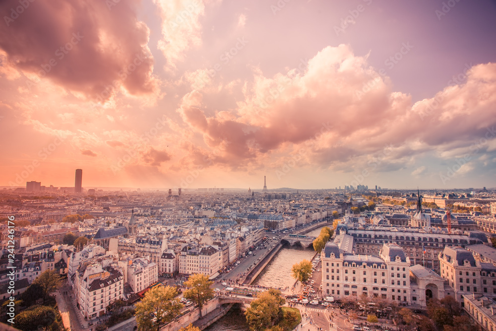 Sunset over the city of Paris France with rooftops seen from above