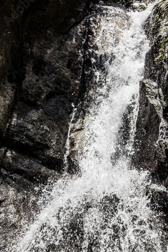 cascading waterfall over the rocks © Benjamin